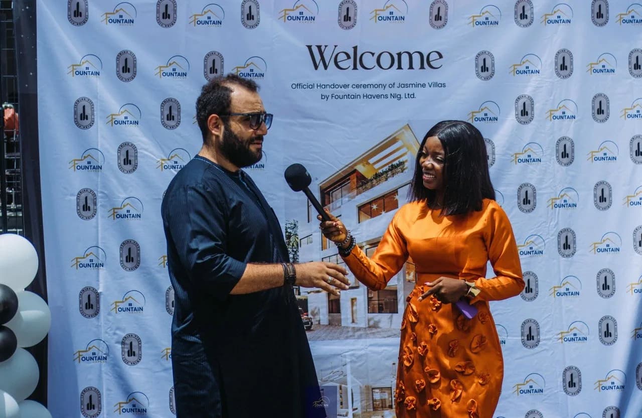 An interview at the welcome backdrop