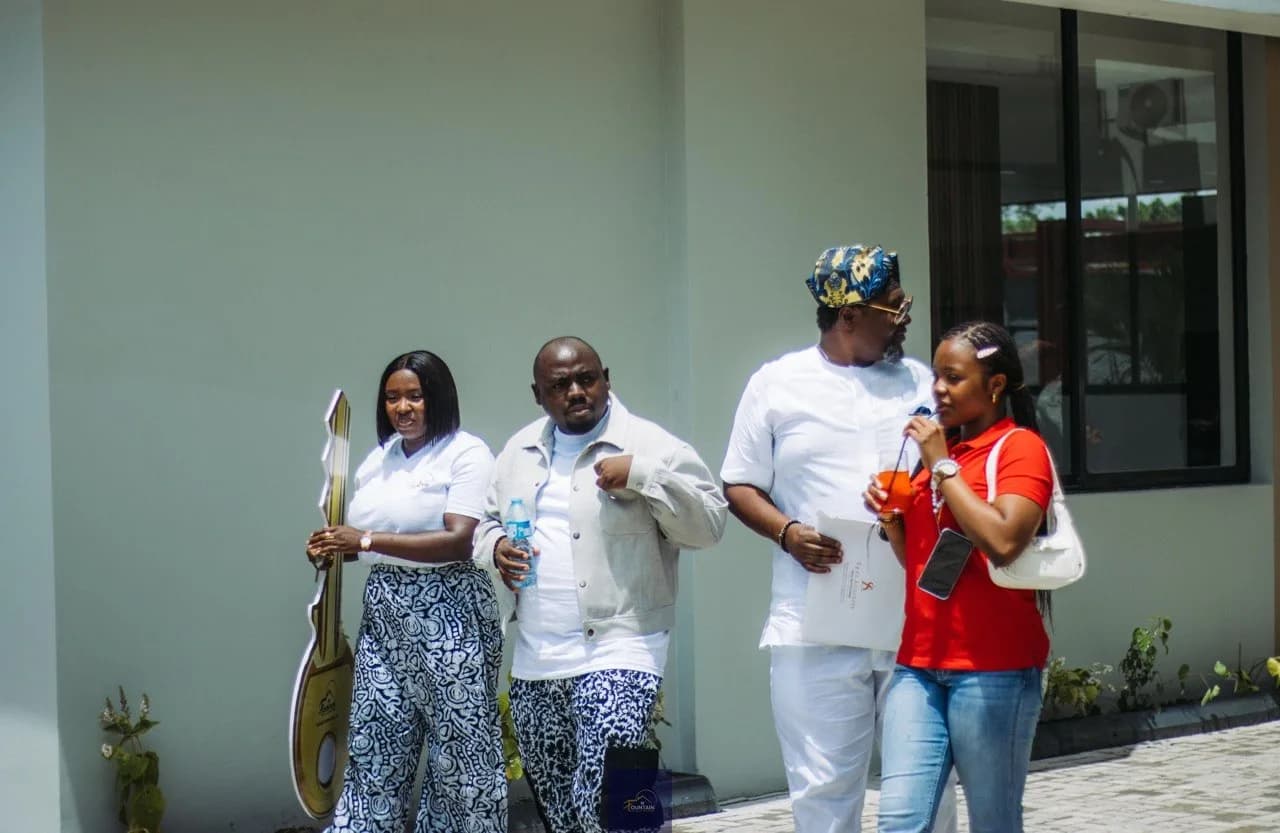Guests gathered outside the completed homes