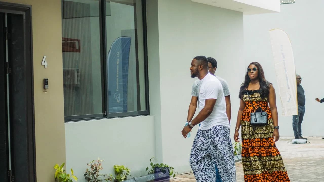 Homeowners walking through the development